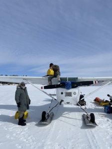 Jacques waits as his plane refuels for the return to civilization