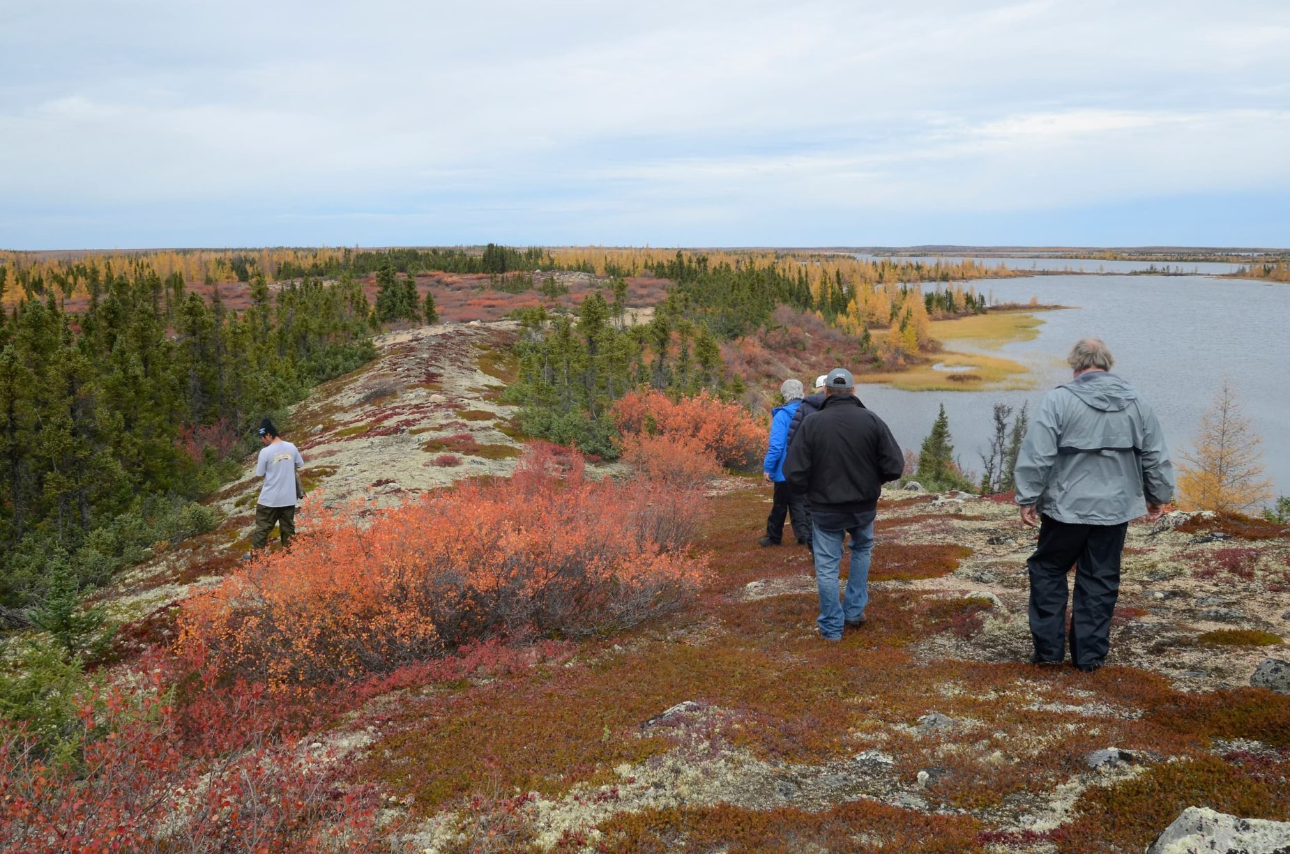 people walking the eskers at Courage lake