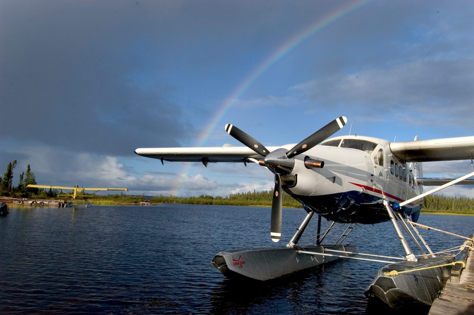 Gangler's floatplane in water with rainbow